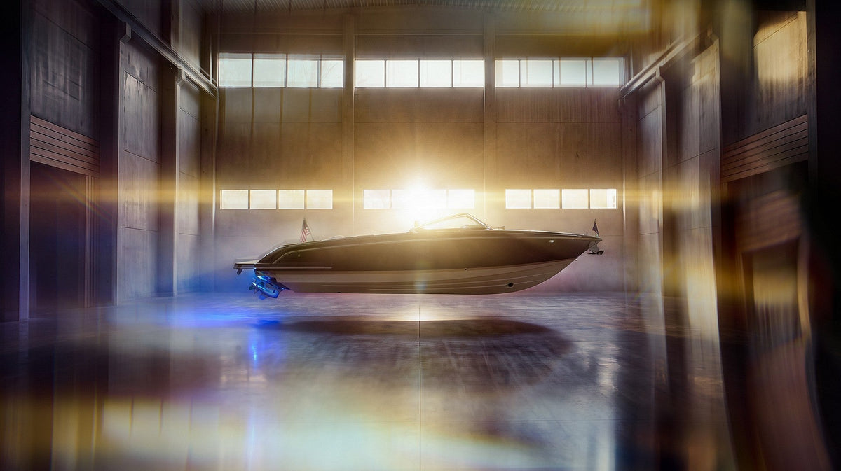 The new Chris-Craft Corsair 27 in profile inside a sunlit warehouse